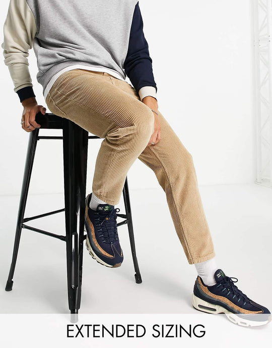 asos design corduroy tapered fit jeans in stone brown
