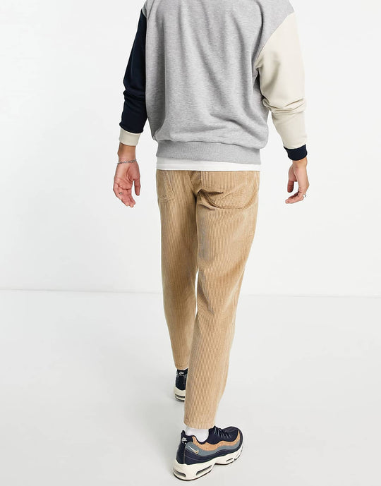 asos design corduroy tapered fit jeans in stone brown