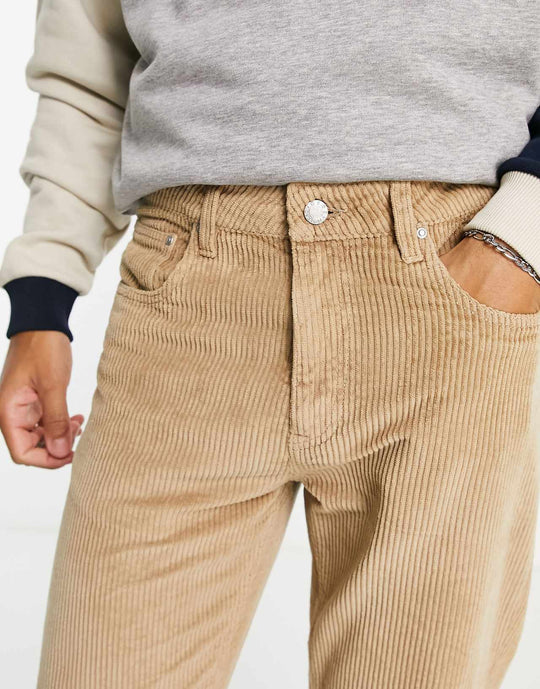 asos design corduroy tapered fit jeans in stone brown
