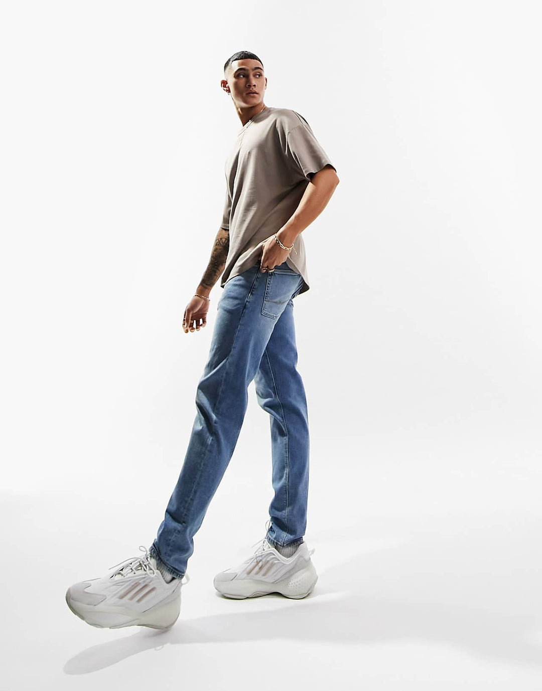 ASOS Design Stretch Tapered Jeans in Vintage Light Wash Blue