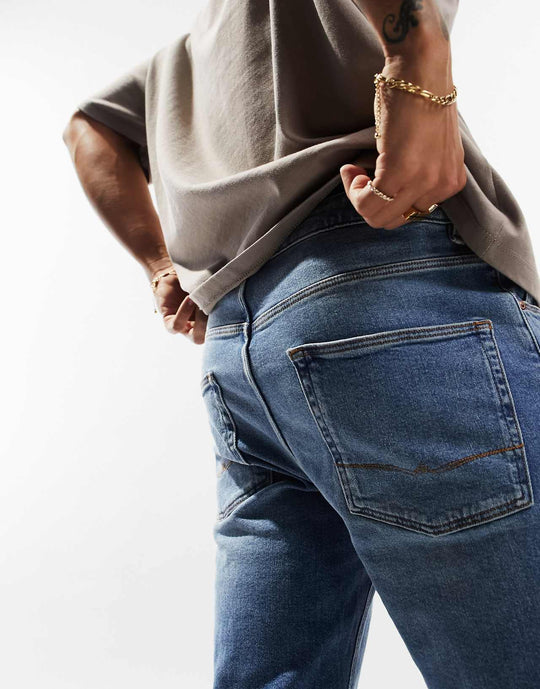 ASOS Design Stretch Tapered Jeans in Vintage Light Wash Blue