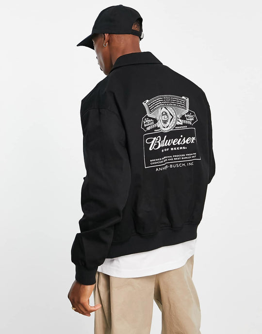 ASOS Design Oversized Varsity Jacket with Budweiser Print in Black