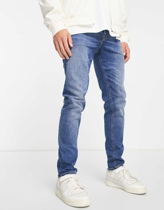 ASOS Design Skinny Jeans in Mid Wash Blue