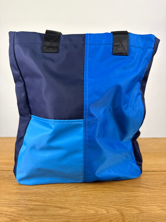 SVNX vibrant vacation tote bag in blue