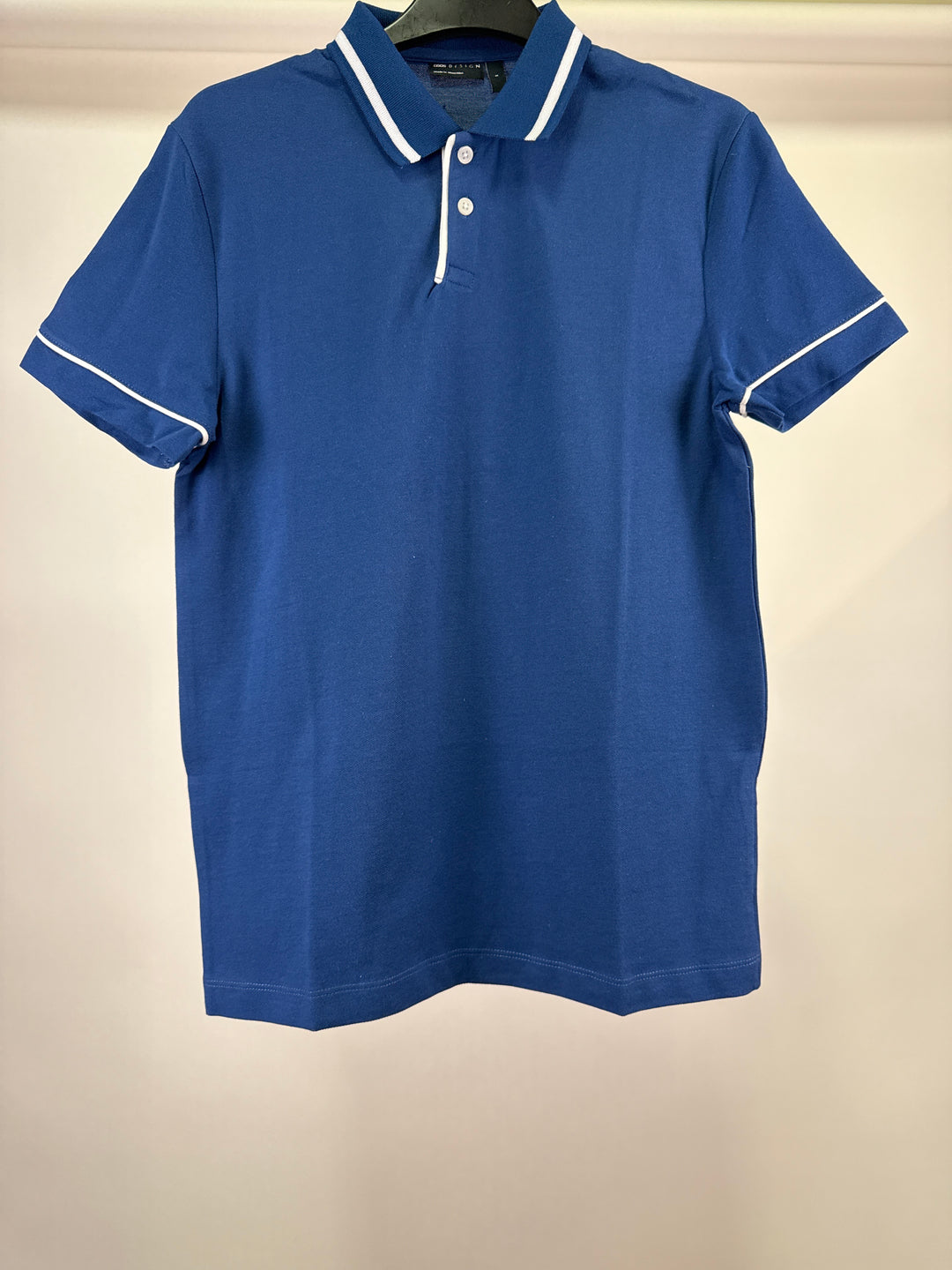 ASOS DESIGN polo with revere in navy with white trims