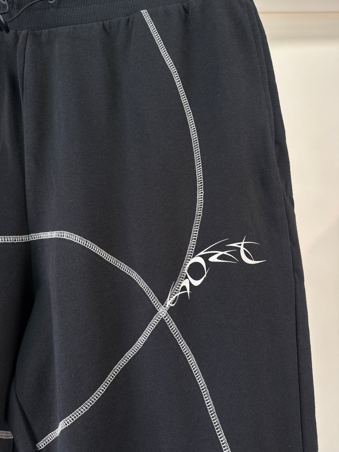 ASOS DESIGN co-ord relaxed joggers in black with tattoo print and stitching detail