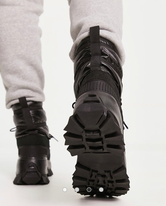 DESIGN puffer chelsea boot on chunky sole with lace detail in black wet.