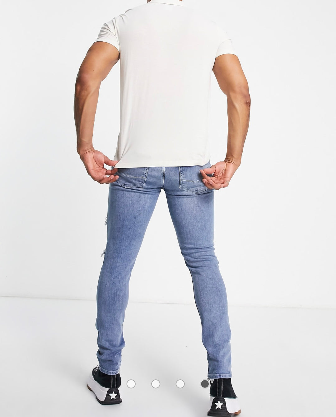 ASOS DESIGN skinny jeans in mid wash blue with heavy rips