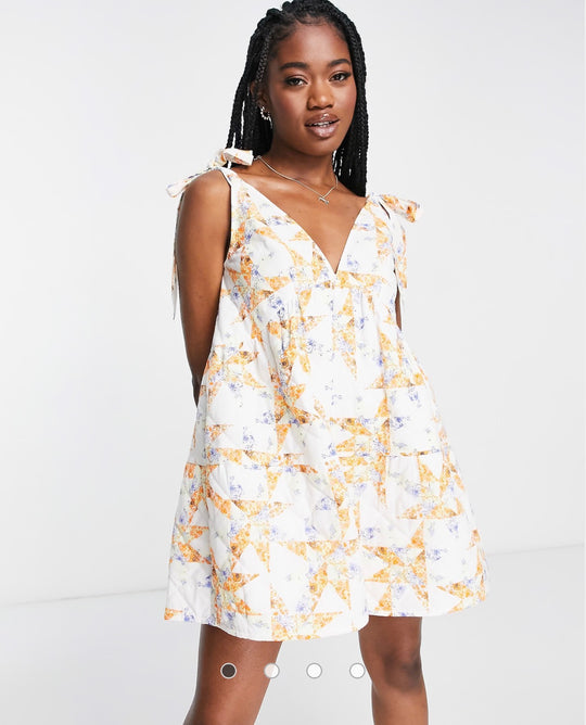 ASOS DESIGN quilted tie shoulder smock playsuit in mixed floral print