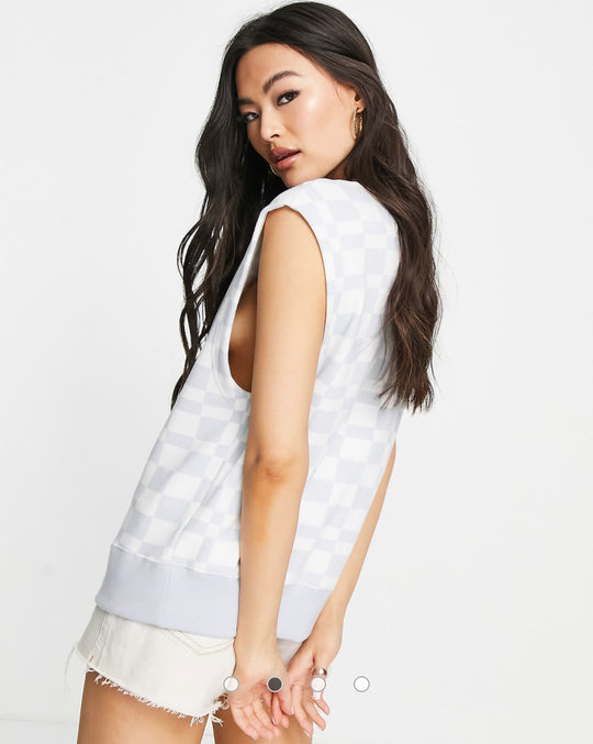 Puma Downtown checkerboard sweater vest in pale blue and white