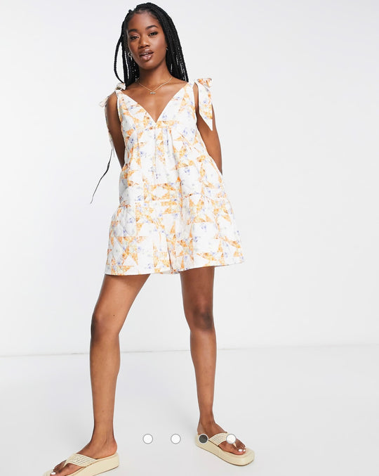 ASOS DESIGN quilted tie shoulder smock playsuit in mixed floral print