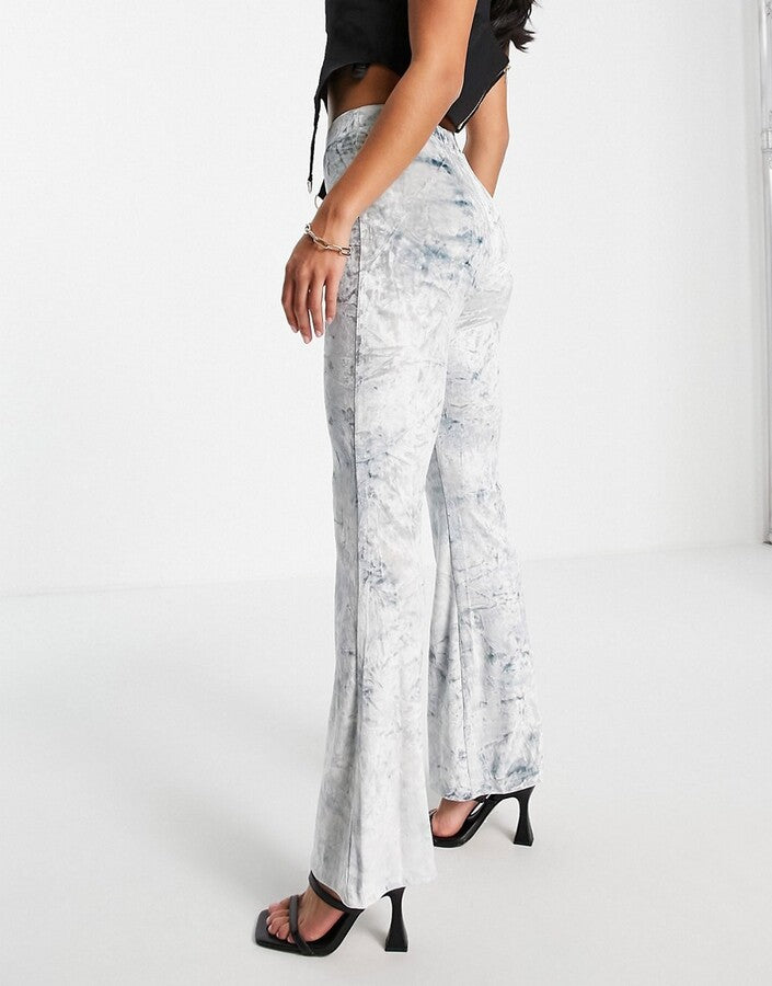 ASOS DESIGN Curve tie dye crushed velvet flare trouser in blue